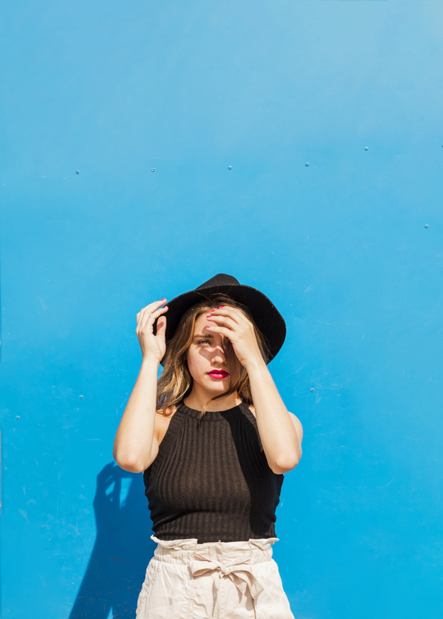 background,people,blue background,blue,beauty,black background,smile,black,happy,wall,human,backdrop,person,hat,background blue,life,lady,studio,shadow