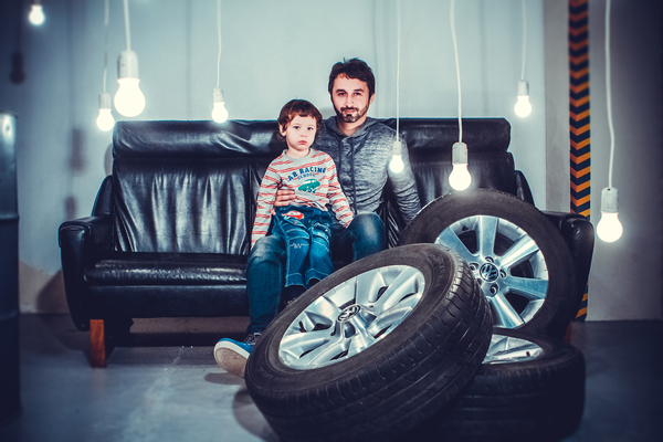 adult,boy,business,chair,child,facial expression,family,father,furniture,indoors,kid,leather,light,light bulbs,man,music,people,photoshoot,portrait,room,seat,sofa,studio,tires,transportation system,wear