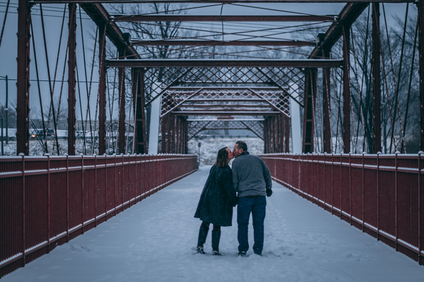 bridge,connection,couple,daylight,kissing,man,modern,outdoors,people,snow,snow capped,steel,urban,winter,woman