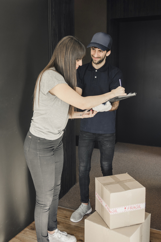 people,man,box,home,delivery,happy,pen,door,service,employee,package,writing,cap,lady,customer,transportation,shipping,customer service,female,young