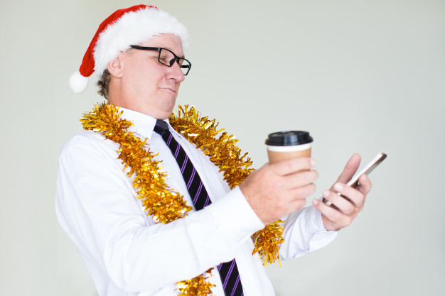 businessperson,caucasian,using,wearing,aged,texting,single,elder,tinsel,standing,smiling,adult,holding,happy christmas,senior,executive,male,concept,eyeglasses,christmas santa,2018,portrait,year,manager,cellphone,balance,christmas hat,message,life,mobile phone,cup,santa hat,hat,business man,new,communication,drink,job,coffee cup,businessman,happy holidays,person,smartphone,glasses,christmas party,holiday,work,happy,celebration,mobile,office,xmas,man,phone,santa,technology,party,happy new year,new year,coffee,business,christmas