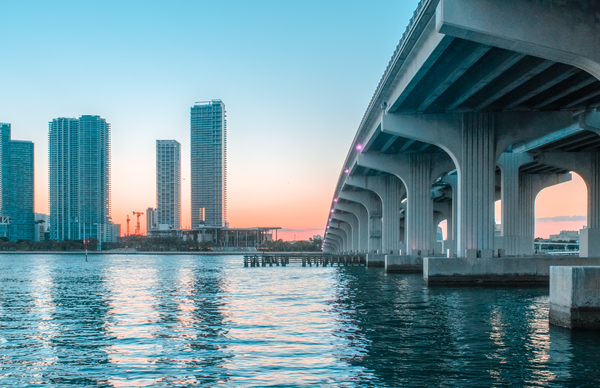 architecture,bridge,buildings,city,cityscape,clouds,concrete structure,downtown,dusk,golden hour,landmark,modern,offices,outdoors,reflections,river,sky,skyline,skyscrapers,sunset,urban,water,waterfront