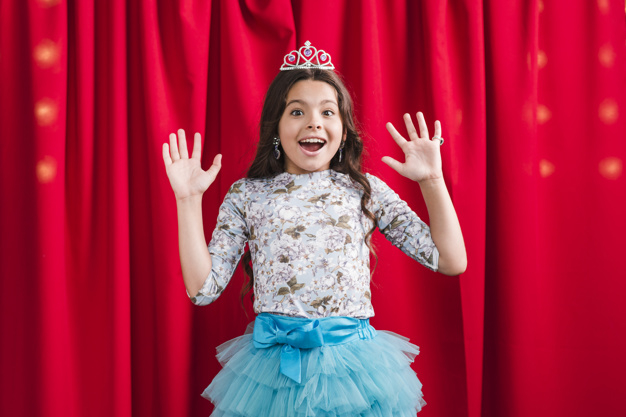 people,crown,beauty,red,cute,smile,happy,kid,child,person,stage,princess,mouth,curtain,theater,show,open,female,happy people,beautiful