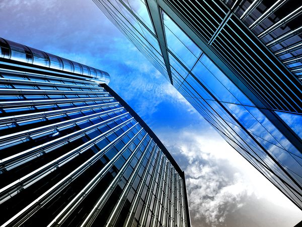 architectural design,architecture,blue sky,business,city,construction,contemporary,downtown,exterior,facade,glass windows,low angle shot,modern,office,offices,outdoors,perspective,reflection,skyscraper,steel,tallest,technology,urban,Free Stock Photo