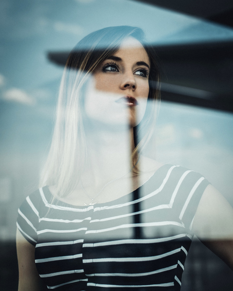 adult,beautiful,close-up,facial expression,fashion,glass,looking,model,person,portrait,pretty,reflection,striped,stripes,window,woman,young,royalty free images