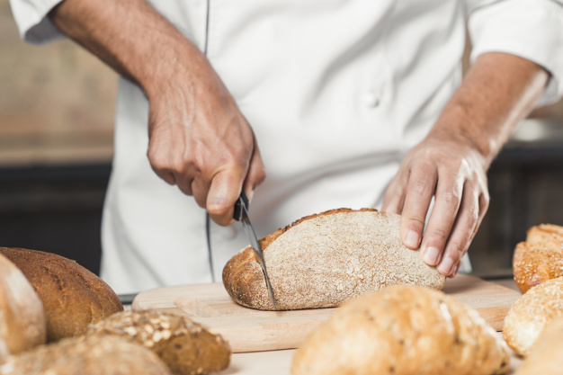 food,business,people,hand,restaurant,man,bakery,kitchen,chef,human,board,person,bread,business people,wheat,business man,breakfast,product,brown,working