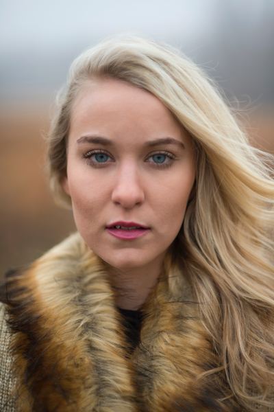 collected,woman,lady,stuff,cloud,grass,woman,girl,forest,woman,female,blonde hair,fur,collar,coat,fashion,portrait,style,wind,outdoors,face