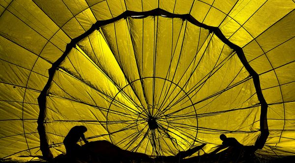 color,pink,blue,plain,light,wall,yellow,flower,vehicle,parachute,yellow,silhouette,people,person,flight,line,light,color,air,balloon,black