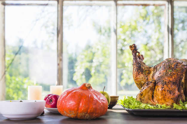 food,tree,green,thanksgiving,table,red,autumn,fruit,chicken,space,celebration,orange,holiday,white,apple,decoration,fall,glass,meat,candle