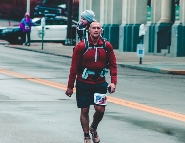 accomplished,action,action energy,adult,athlete,baby,city,downtown,exercise,father,fitness,jogger,man,marathon,outdoors,parent,people,race,recreation,road,run,runner,running,sport,street,wear,royalty free images