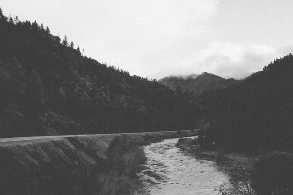 landscape,river,water,road,rural,mountains,hills,trees,nature,fog,sky,clouds,black and white
