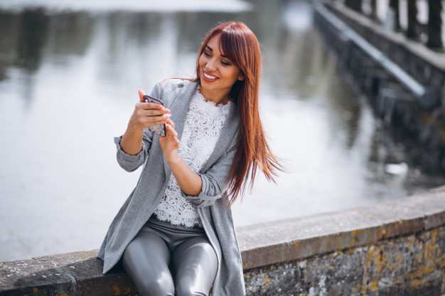 business,people,technology,summer,phone,hair,mobile,face,spring,white,communication,reading,business woman,female,smart,adult,european,pretty,busy,smiling