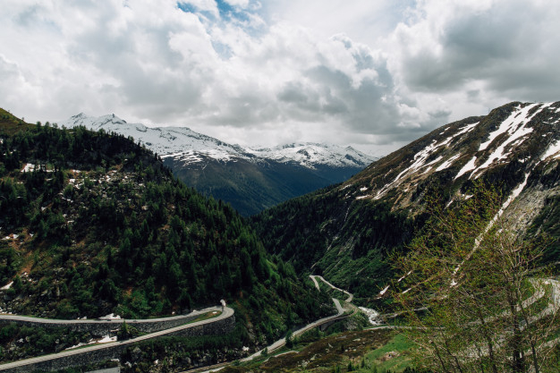 snow,summer,green,nature,mountain,road,sky,landscape,time,rock,adventure,curve,mountains,tourism,vacation,europe,outdoor,tour,climbing,scenery
