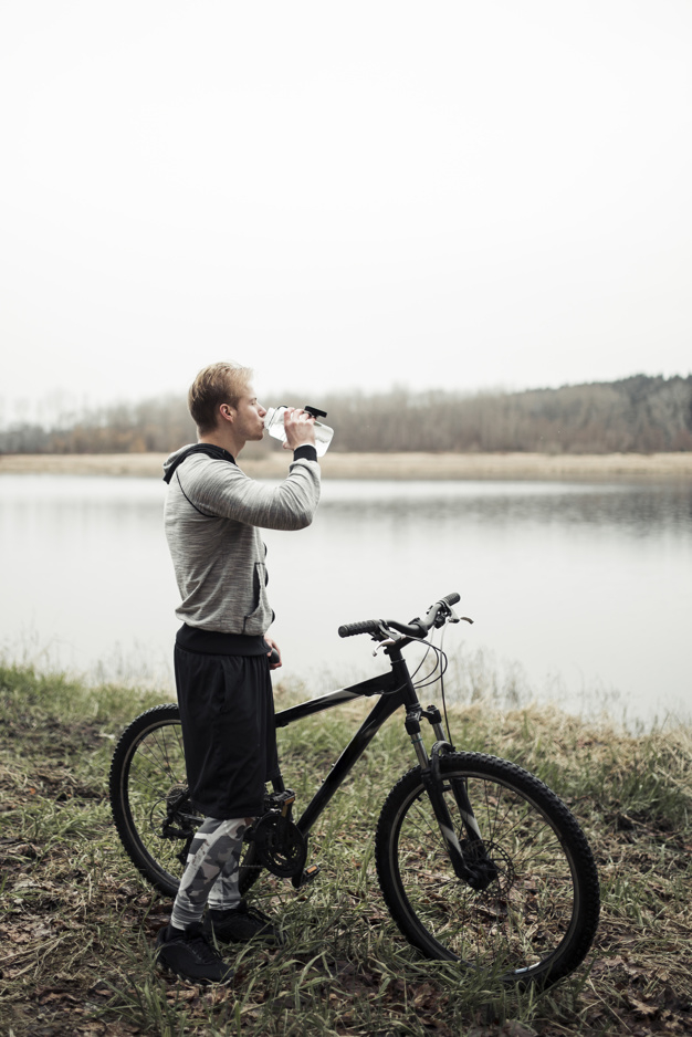 people,water,man,nature,sport,sea,fitness,sky,grass,sports,bicycle,person,bottle,drink,transport,clothing,healthy,adventure,exercise,cycle