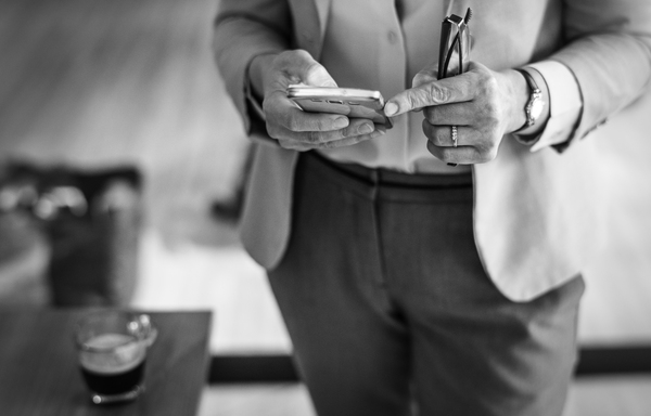 black and white,blazer,boss,business,businesswoman,busy,bw,cafe,casually,ceo,checking,coffee,coffee shop,corporate,digital,digital device,email,formal,glasses,gray,gray scale,manager,messaging,mobile phone,morning,on social,online,out of office