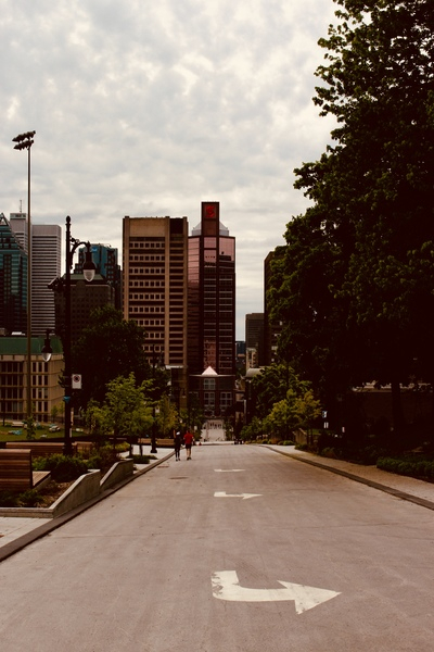 architecture,arrow,building,canada,city,daylight,downtown,montreal,outdoors,overcast,people,road,skyscraper,skyscrapers,street,travel,tree,urban,walking