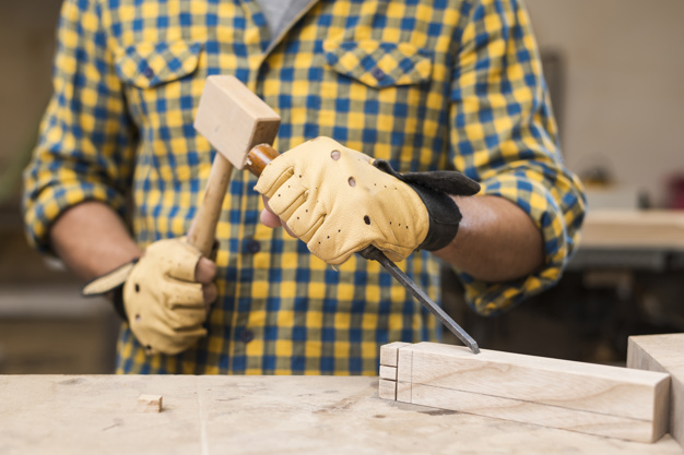 people,wood,man,table,work,furniture,human,person,decoration,worker,safety,working,wooden,creativity,wood table,hammer,craft,workshop,tool,block