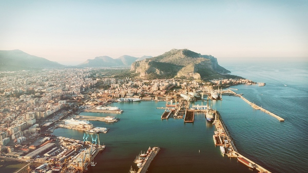 architecture,bay,beach,city,cityscape,daylight,dock,drone shot,harbour,high angle shot,island,italy,landscape,mountain,ocean,outdoors,pier,port,sea,seashore,ship,tourism,transportation system,travel,water,watercraft
