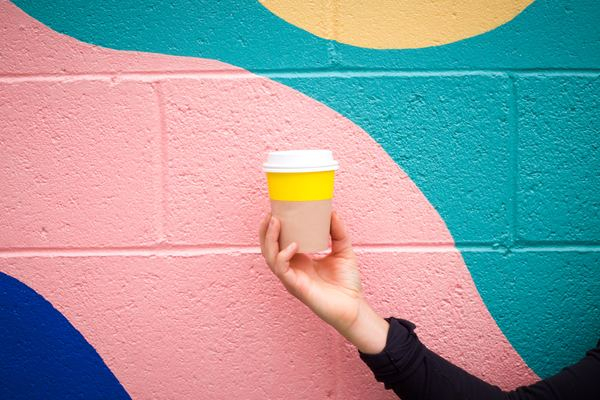 curiosity,wall,fashion,hand,woman,girl,fun,woman,yellow,togo cup,painted wall,wallpaper,design wallpapers,design backgrounds,drink,coffee cup,hot drink,beverage,wall,grafitti,to go,free images