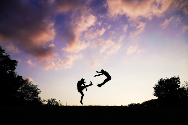 clouds,fight,jumping,karate,kick,martial arts,people,silhouette,sky,twilight,Free Stock Photo