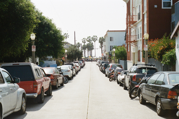 street,parking,cars,trucks,motorcycle,houses,apartments,buildings,palm trees,sunshine