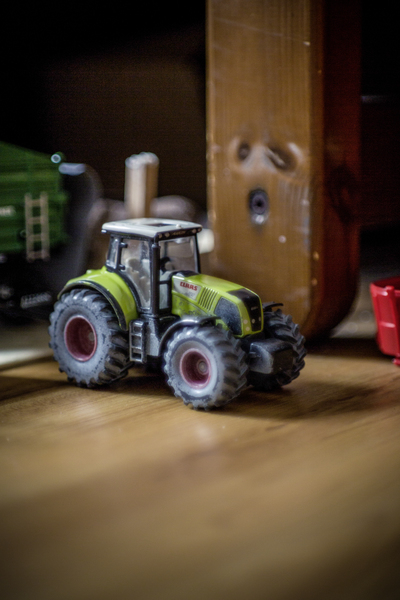 action,agricultural machine,blur,car,floor,fun,game,imagination,indoors,joy,miniature,play,playful,toy,tractor,vehicle,wood,wooden,Free Stock Photo