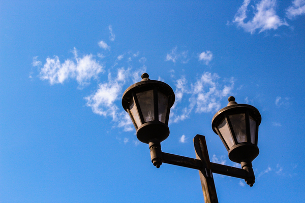 weather,streetlight,street,sky,outdoors,low angle shot,light,lantern,lamppost,lamp post,lamp,family,electricity,daylight,cloudy sky,clouds,bulb,bright,blue sky,architecture