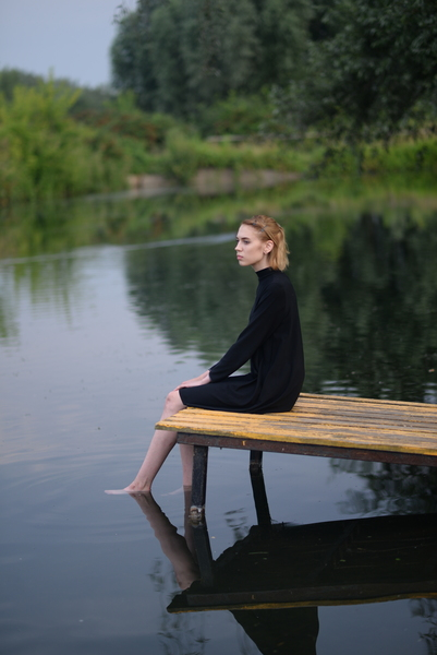 alone,dock,lake,leisure,person,river,sitting,solo,woman