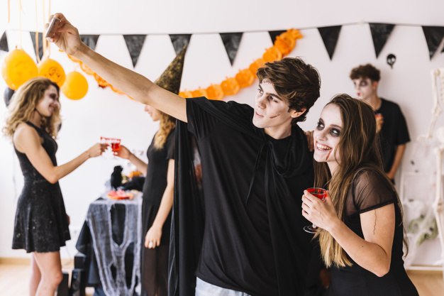 party,technology,halloween,red,autumn,space,celebration,orange,black,smartphone,decoration,glass,drink,fall,blood,teenager,selfie,zombie,together,young