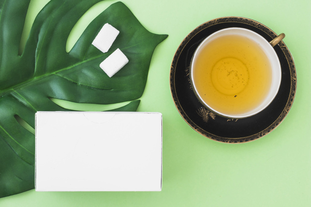background,floral,leaf,green,box,green background,health,tea,white background,white,drink,flower background,cup,breakfast,cube,natural,healthy,plate,spoon,background green