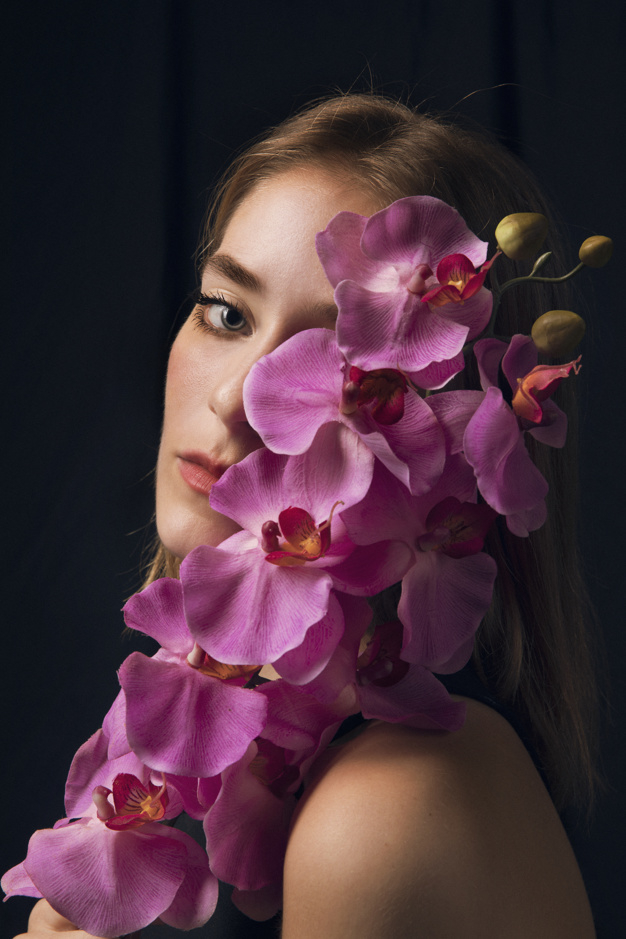 looking at camera,studio shot,pensive,side view,thoughtful,blond,side,gorgeous,bloom,dreaming,standing,looking,calm,pretty,shot,adult,holding,petal,season,bright,portrait,beautiful,view,blossom,fresh,young,dark,female,romantic,branch,studio,lady,model,natural,plant,person,purple,colorful,black,spring,face,cute,black background,hair,pink,camera,woman,summer,flower,background