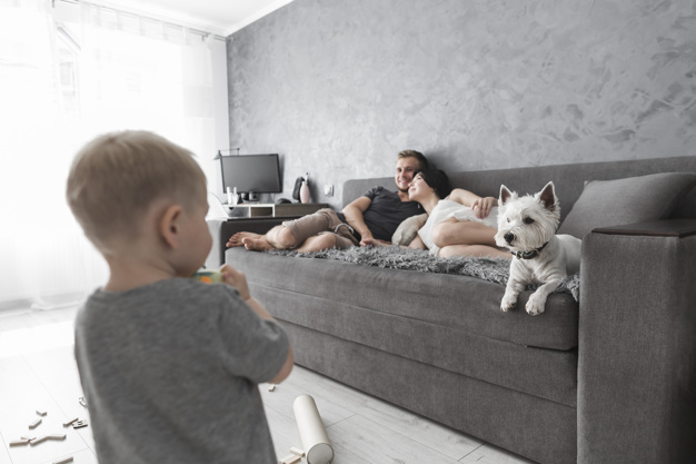 people,house,dog,man,animal,beauty,home,kid,mother,child,room,couple,boy,pet,modern,interior,father,group,sofa,lady