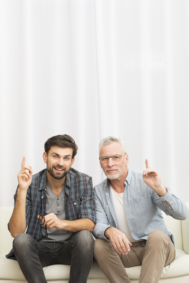 background,camera,man,home,space,smile,white background,happy,furniture,room,white,finger,fun,father,sofa,cloth,together,young,background white,happiness,sitting,elderly,eyeglasses,male,senior,guy,parent,fingers,smiling,copy,looking,wear,casual,son,accessory,aged,joyful,settee,indoors,at,fatherhood,copy space,toothy,looking at camera,multigenerational,toothy smile,upped,with