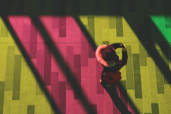 person,hand,man,texture,wallpaper,green,spiritual,religion,worship,person,light,phone,woman,shadow,cell phone,pink,yellow,using phone,color,stained glass,selfie