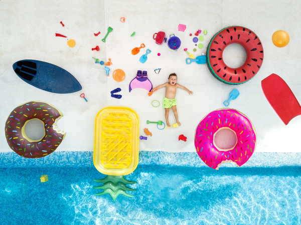 swimming pool,toy,child,aerial view,directly above,inflatable,fun,summer,water,boys,choice,happiness,large group of objects,childhood,lying down,photography,stuffed toy,2 3 years,front view,full length,people,variation,abundance,carefree,casual clothing,children only,color image,cute,day,drone point of view,elementary age,enjoyment,horizontal,imagination,innocence,latin america,leisure activity,lifestyles,looking at camera,looking up,lying on back,males,mexico,one boy only,one person,outdoors,playful,portrait,relaxation,sunny,toothy smile,vacations