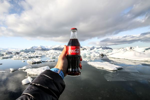 coca cola,coke,red,color,woman,abstract,close,light,hand,glass bottle,holding bottle,coca cola,bottle,beverage,drink,coke,brand,hand,reach,reaching,glacier