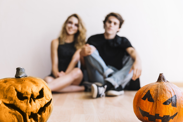party,halloween,red,autumn,space,celebration,orange,black,makeup,decoration,drink,fall,teenager,pumpkin,zombie,young,masquerade,sitting,focus,season