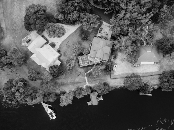 architecture,bird&#39;s eye view,black and white,boat,dock,houses,landscapes,outdoors,river,roofs,transportation system,trees,water