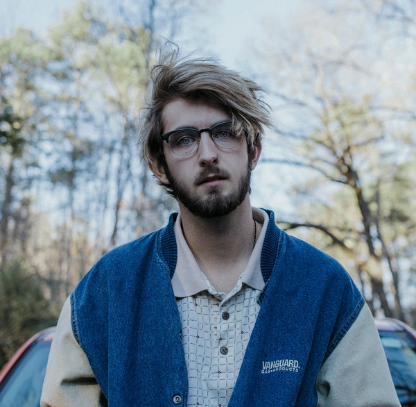 man,guy,male,fashion,model,eyeglasses,trees,sky,branches,clouds,nature,car,windshield,outdoor,beard,bokeh