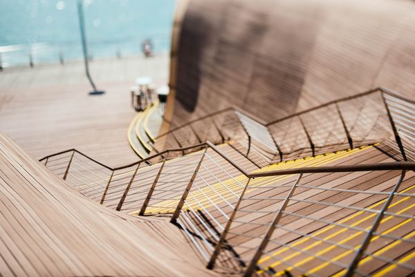 architecture,building,structure,field,light,sunset,architecture,pattern,facade,staircase,stairs,wood,brown,water,railing,outside,wooden,seafront,ladder
