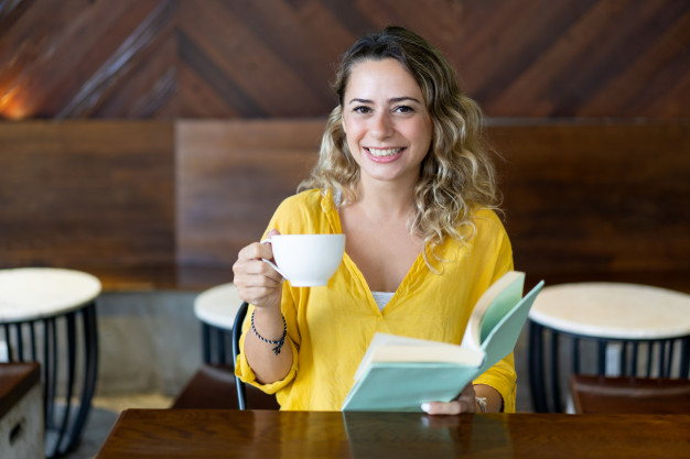 business,coffee,book,restaurant,woman,girl,table,student,happy,cafe,time,person,breakfast,reading,lady,college,business woman,female,young,beautiful,beauty woman,studying,positive,businesswoman,literature,adult,pretty,smiling,casual,novel,dreamy,coffeeshop,spending,charming,enjoying