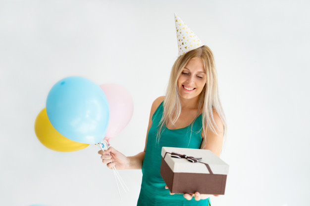 birthday,happy birthday,gift,box,hair,gift box,happy,balloon,person,present,hat,package,cap,model,studio,female,young,air,beautiful