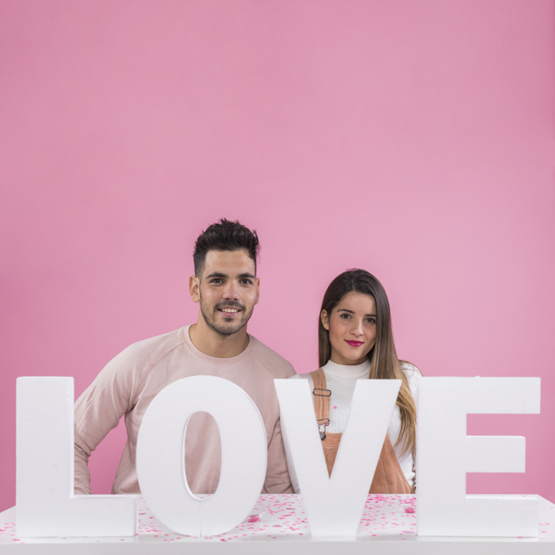 background,love,woman,camera,man,table,pink,space,cute,valentine,white background,happy,text,holiday,square,letter,couple,white,pink background,happy holidays,studio,cute background,love background,romantic,together,young,word,background pink,background white,beautiful,portrait,bright,lifestyle,square background,beauty woman,love couple,positive,relationship,adult,shot,pretty,smiling,copy,looking,standing,two,girlfriend,handsome,casual,boyfriend,cheerful,inscription,format,brunette,joyful,affection,near,tenderness,at,copy space,closeness,studio shot,looking at camera,square format
