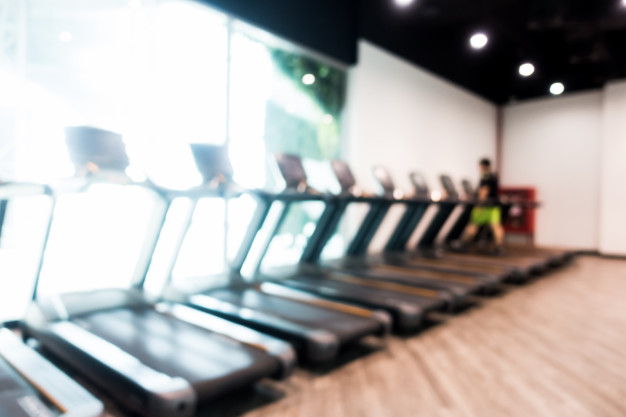 Free: Abstract blur gym and fitness room interior 