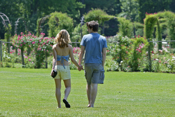 couple,people,romantic,romance,love,holding,hands,rose,garden,park,flowers,stroll,man,woman,girl,lady,boy,grass,summer,walk,young,youth,blush,pair,partners,togetherness,human,dating,date,barefoot,domestic,sunshine,sun,relax