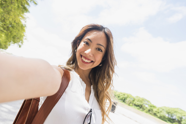people,city,woman,cloud,camera,sky,beauty,chinese,smile,happy,bag,person,japanese,modern,park,sunglasses,lady,selfie,womens day,female,young,happy people,asian,portrait,lifestyle,beauty woman,day,tourist,positive,holding,adult,pretty,smiling,looking,outdoors,self,front,casual,cheerful,outside,joyful,taking,closeup,daytime,photographing,toothy