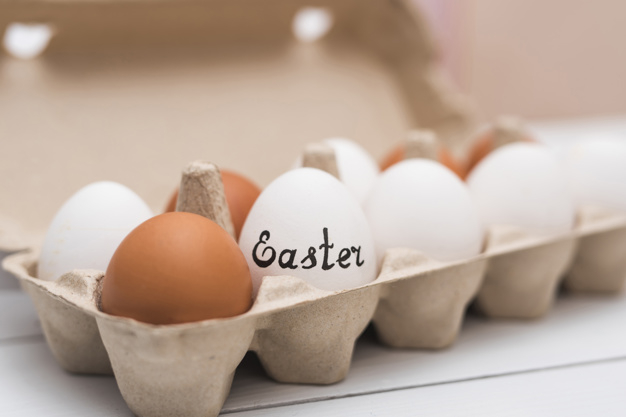closeup,arrangement,inscription,small,blurry,april,row,composition,surface,rack,tray,horizontal,carton,season,decor,cardboard,beautiful,festive,container,word,shell,traditional,brown,symbol,egg,natural,religion,desk,decoration,easter,white,letter,event,holiday,text,celebration,spring,table,box,light,food