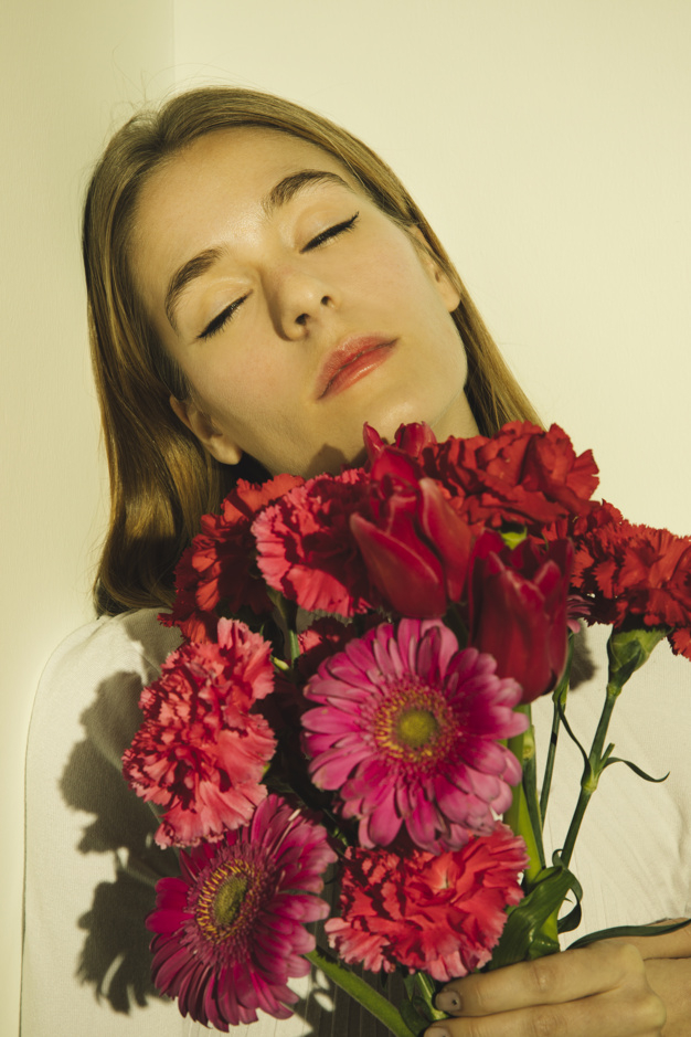pensive,indoors,thoughtful,closed eyes,blond,bunch,serious,gerbera,casual,dreaming,carnation,standing,calm,pretty,holding,different,closed,woman hair,beauty woman,bright,portrait,beautiful,pink flower,tulip,fresh,young,woman face,bouquet,female,romantic,sad,branch,cute background,light background,model,nature background,natural,eyes,flower background,plant,pink background,white,clothes,room,wall,white background,spring,face,cute,red background,hair,red,pink,light,woman,flowers,flower,background