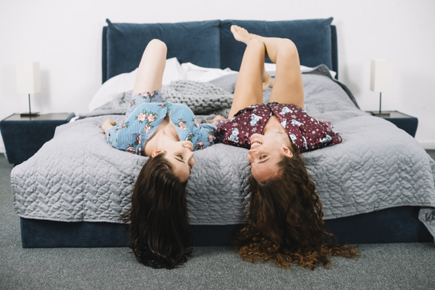 people,love,house,hand,woman,fashion,hair,home,beauty,smile,eye,room,friends,bed,nail,fun,model,youth,romantic,bedroom,female,together,young,holding hands,fashion model,beauty woman,woman hair,closed,blanket,romance,curly,holding,adult,pretty,stylish,smiling,two,relaxing,casual,lesbian,togetherness,lying,bonding,fashionable,closeup,indoors