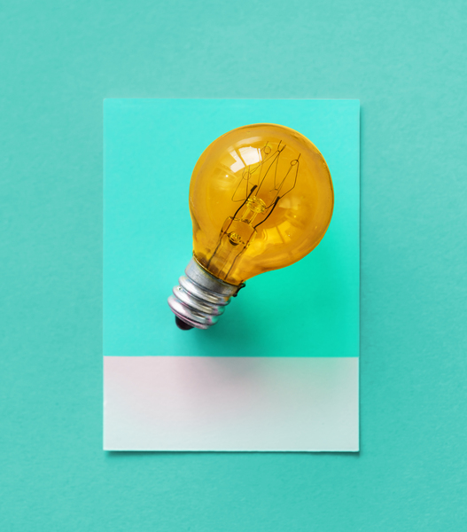 bulb,card,colorful,concept,conceptual,creative,creativity,design,electric,electrical,electricity,energy,glass,glowing,green,heat,idea,image,innovation,inspiration,invention,isolated,light,light bulb,object,orange,paper